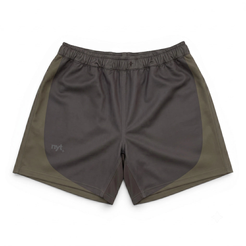 Two-tone shorts with a dark gray front and green sides on a white background